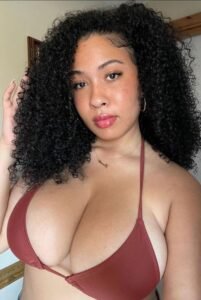Curvy Afro-Latina woman with natural curls in bikini top – Maya Solé