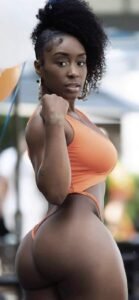 Sasha Fierce – Strong Caribbean woman in orange bikini posing seductively in Birmingham UK