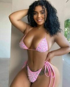 Amara Rose – Caribbean woman in sparkling pink bikini posing seductively in London UK