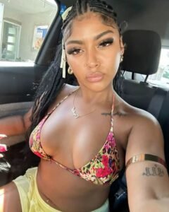 Nylah Blaze – Curvy Caribbean woman with braids in floral bikini offering adult phone sex in Manchester UK