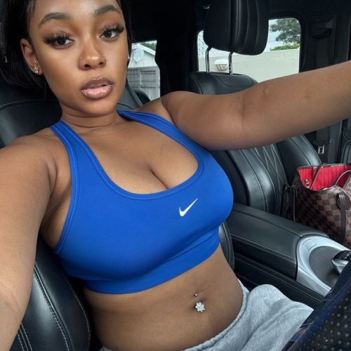 Sporty Caribbean girl Nalia Dash in blue crop top teasing for adult phone chat in UK